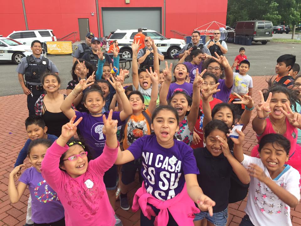 A group of children  cheering 