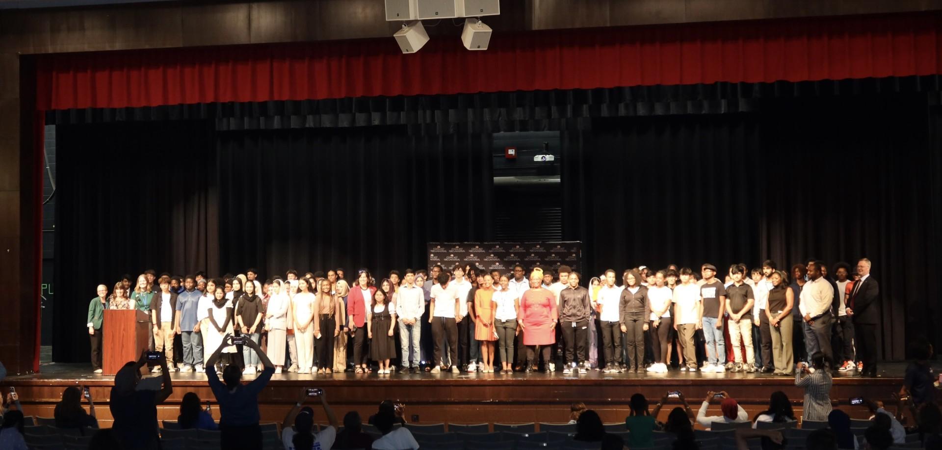 SYEP Participants stand on stage at ceremony.