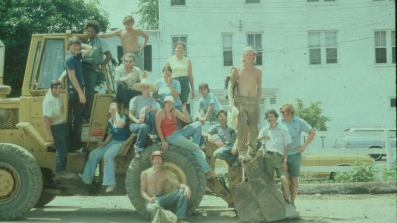 Archaeology Crew posing on a backhoe, 500 King Street excavation