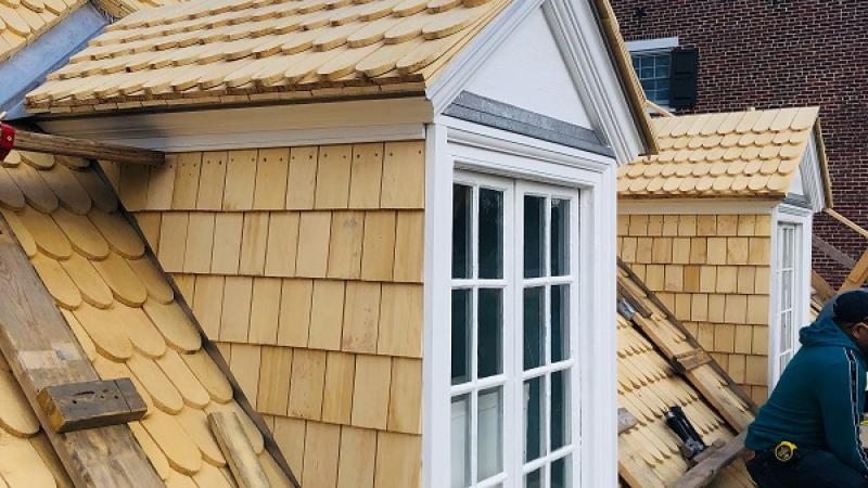 Nailing shingles on the roof