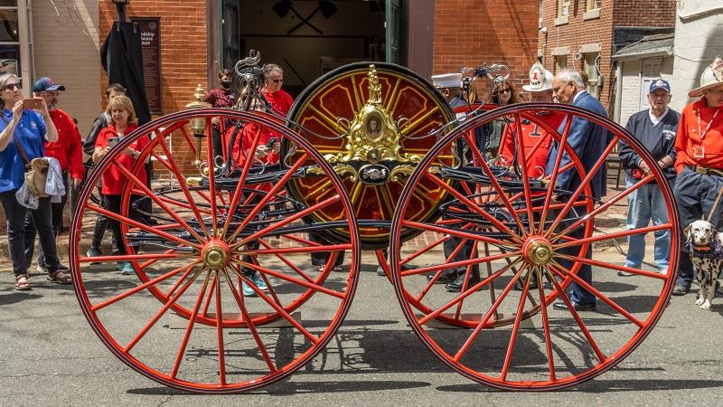 Hose Reel Carriage in front of Friendship Firehouse Museum