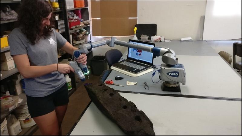 Archaeologist with timber and scanning equipment