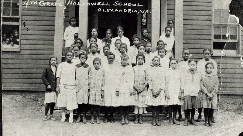 Girls in front of school entrance