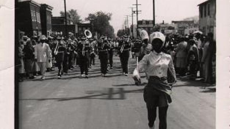 Majorette marching in Uptown Parade, snapshot