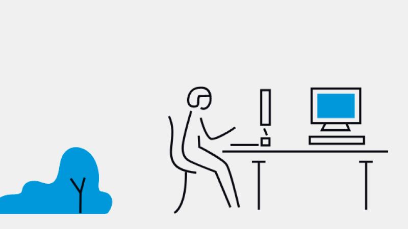 graphic of person sitting at desk in front of a computer