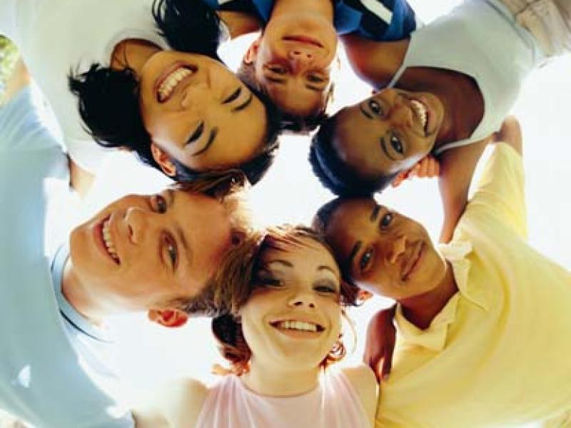 Group of diverse teens in a huddle