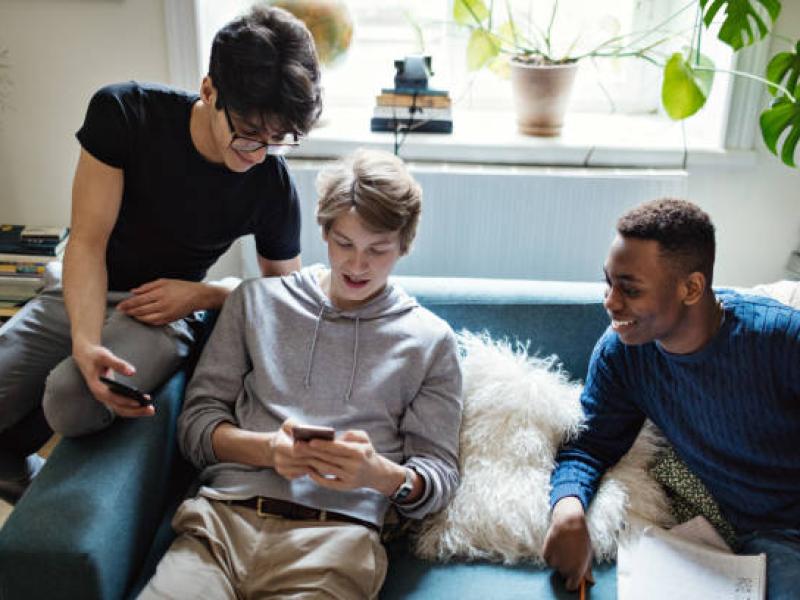 Teens reading information online 