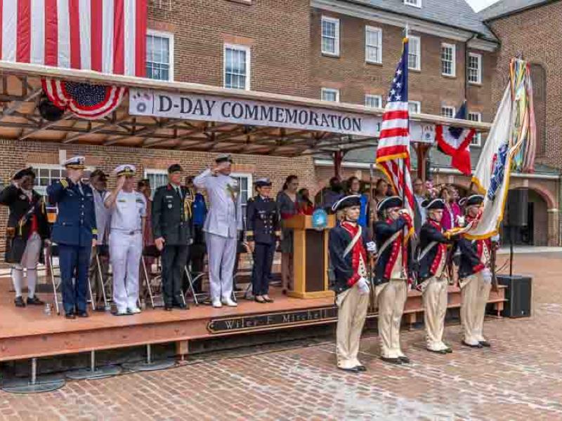 Revolutionary War reenactors in front of WWII veterans