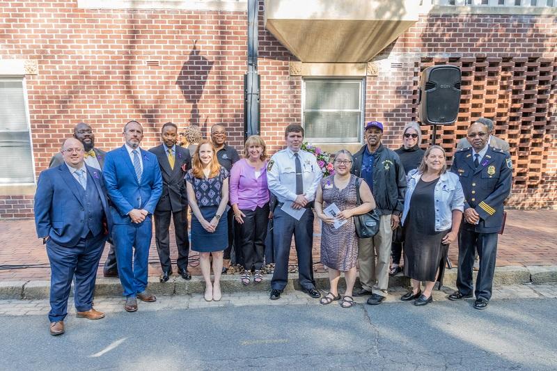 Participants and dignitaries gather at the site of the lynching