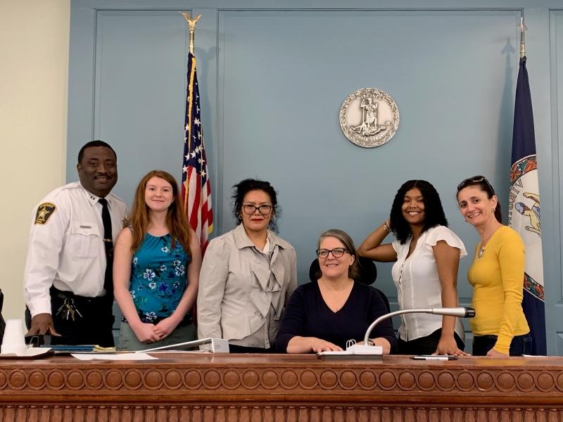 deputy with five civilians in courtroom