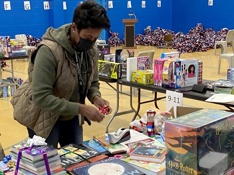 civilian staff wrapping books