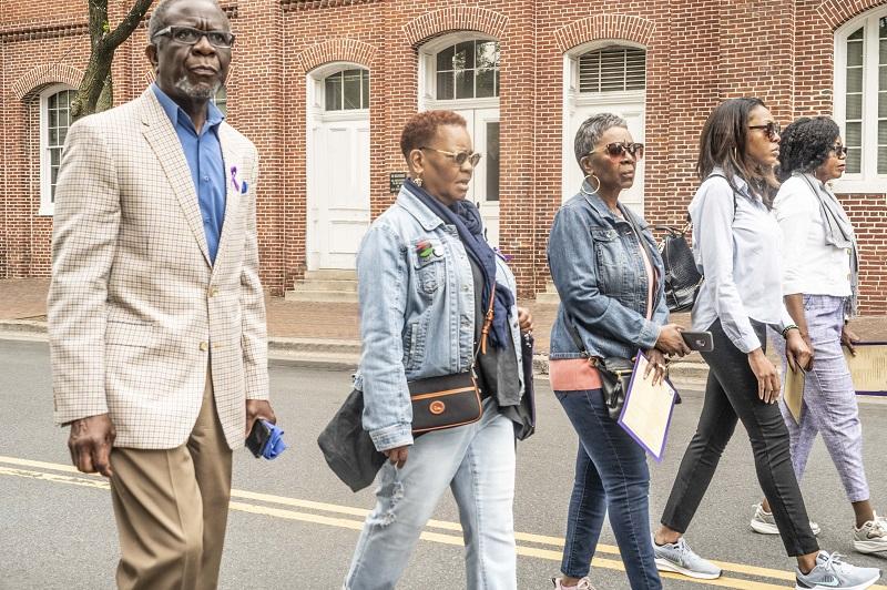 Five people walking on Fairfax Street