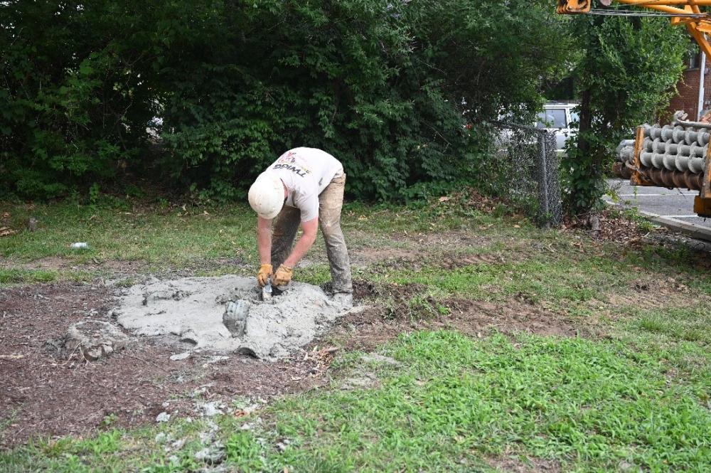 A contractor for the City sealing a boring hole after completing the geotechnical investigation. (City of Alexandria) 