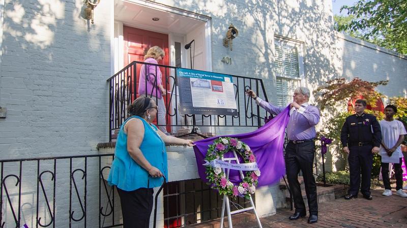 Unveiling the trail sign at the site of the old jail