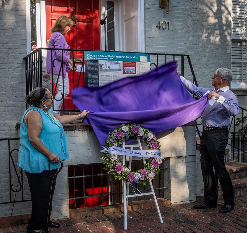 Unveiling the trail sign at the site of the old jail