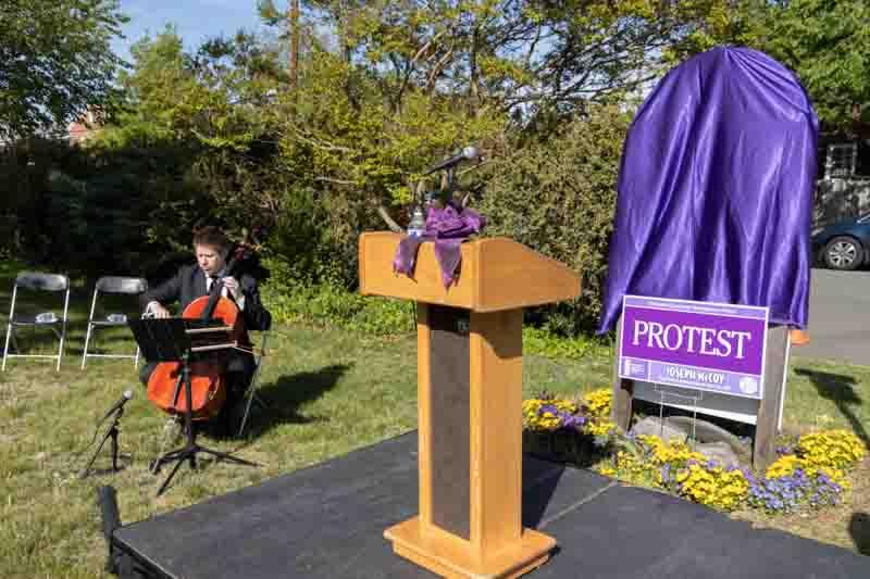 McCoy Remembrance. Cellist Tim Thulson and podium