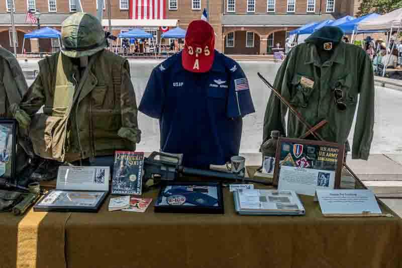 Exhibit table with uniforms