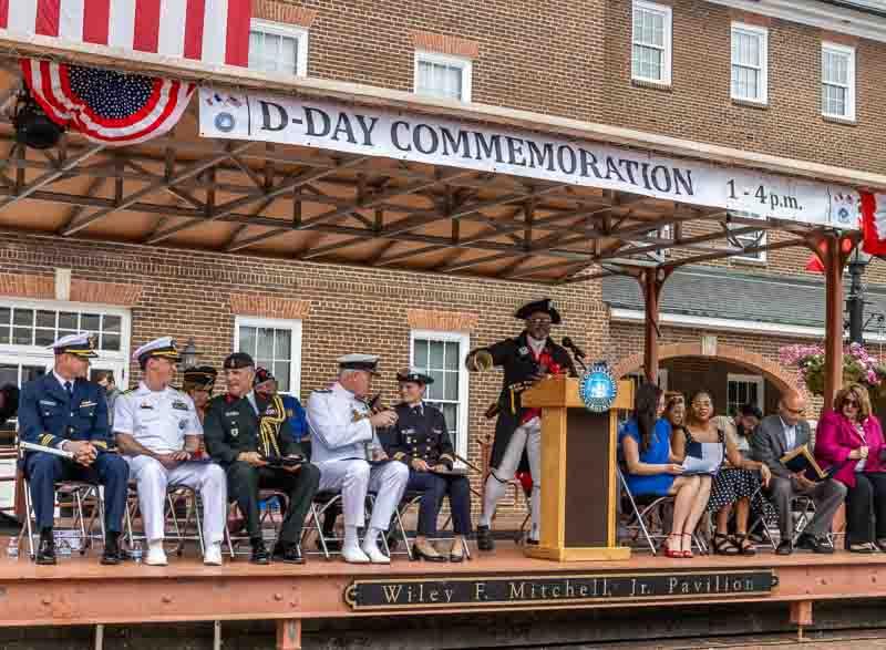 Town crier and digneteries on stage