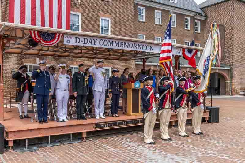 Revolutionary War reenactors in front of WWII veterans