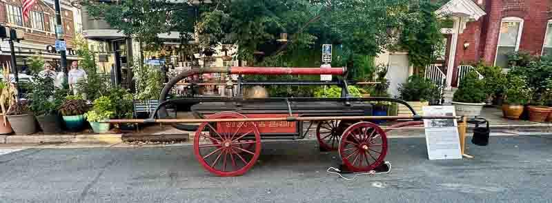 A handpumper painted black and red