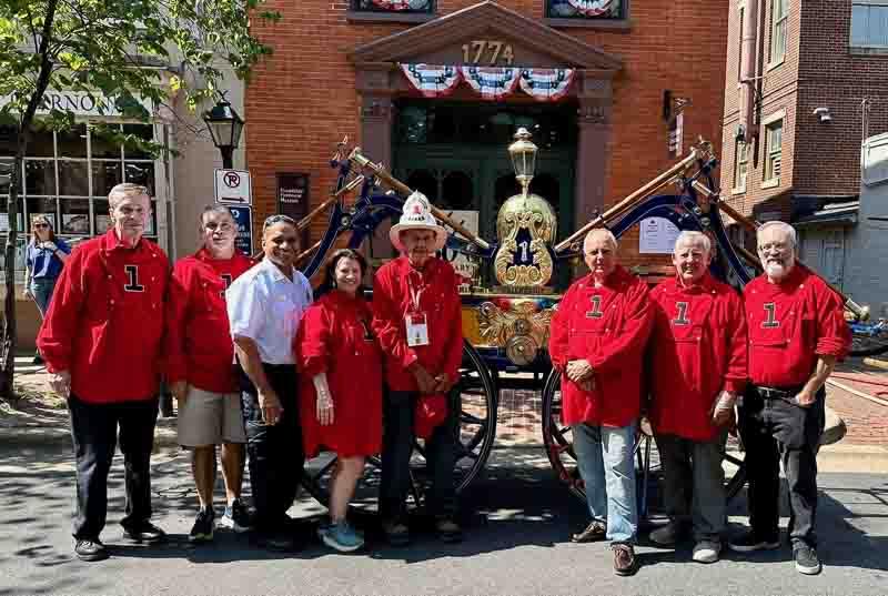 Members of FVFEA poste with the Rodgers Pumper outside of the firehouse