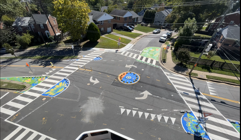 Image of street mural from bucket truck.