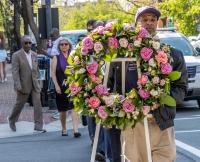 Procession to the lynching site, corner of Cameron and N. Lee Streets, led by McArthur Myers, WPM, Worshipful Grand Historian, Universal Lodge #1