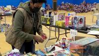 civilian staff wrapping books