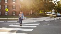 A person crossing the street