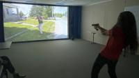 civilian holding a training weapon in simulated firearms training 