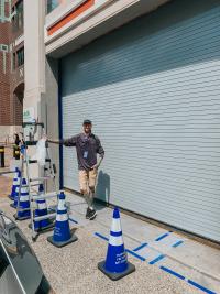 Silas Baker beginning his work on the mural