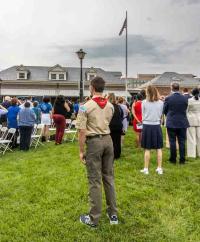 Audience standing, Alexandria Union Station in background