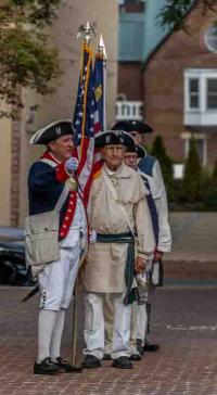 Colonial reenactors with flag