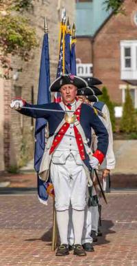 Colonial reenactors with flag