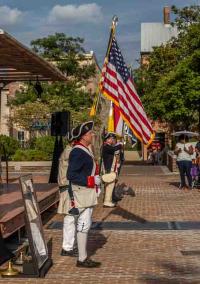 Colonial reenactors with flag