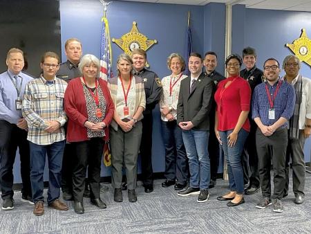 eleven civilians and deputies standing