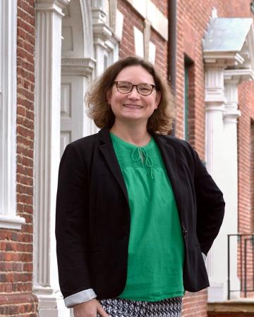 Liz Williams in front of the Gadsby's Tavern doorway