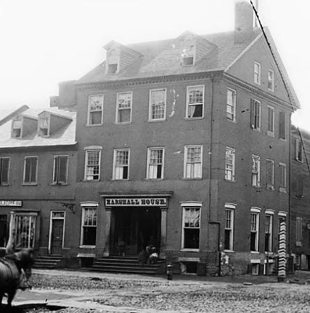 Marshall House Hotel with sign and mostly empty street