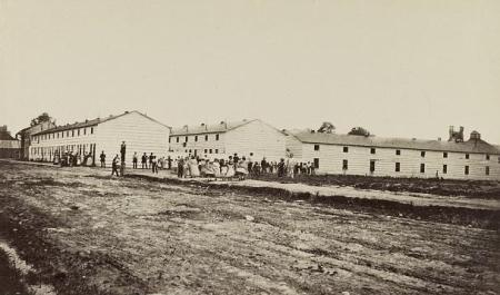 Black and white photo of large barracks