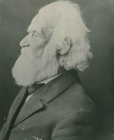 photo of man with white beard facing left