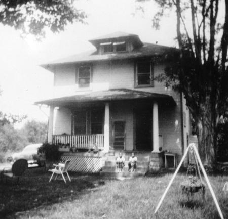 Four-Square house with porch and trees