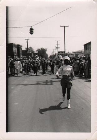 Majorette marching in Uptown Parade, snapshot