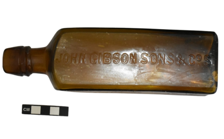 A bottle with "JOHN GIBSON SONS & CoS" running along one side