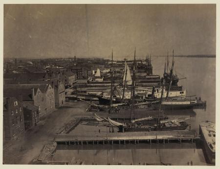 A photo showing tall ships docked along Alexandria's many wharves