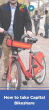 man pushing bikeshare bike