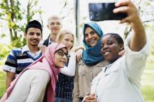 Diverse group of teens taking a selfie