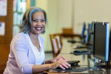 employment training photo of woman at computer